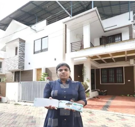 Anna Infront of her House with Lottery